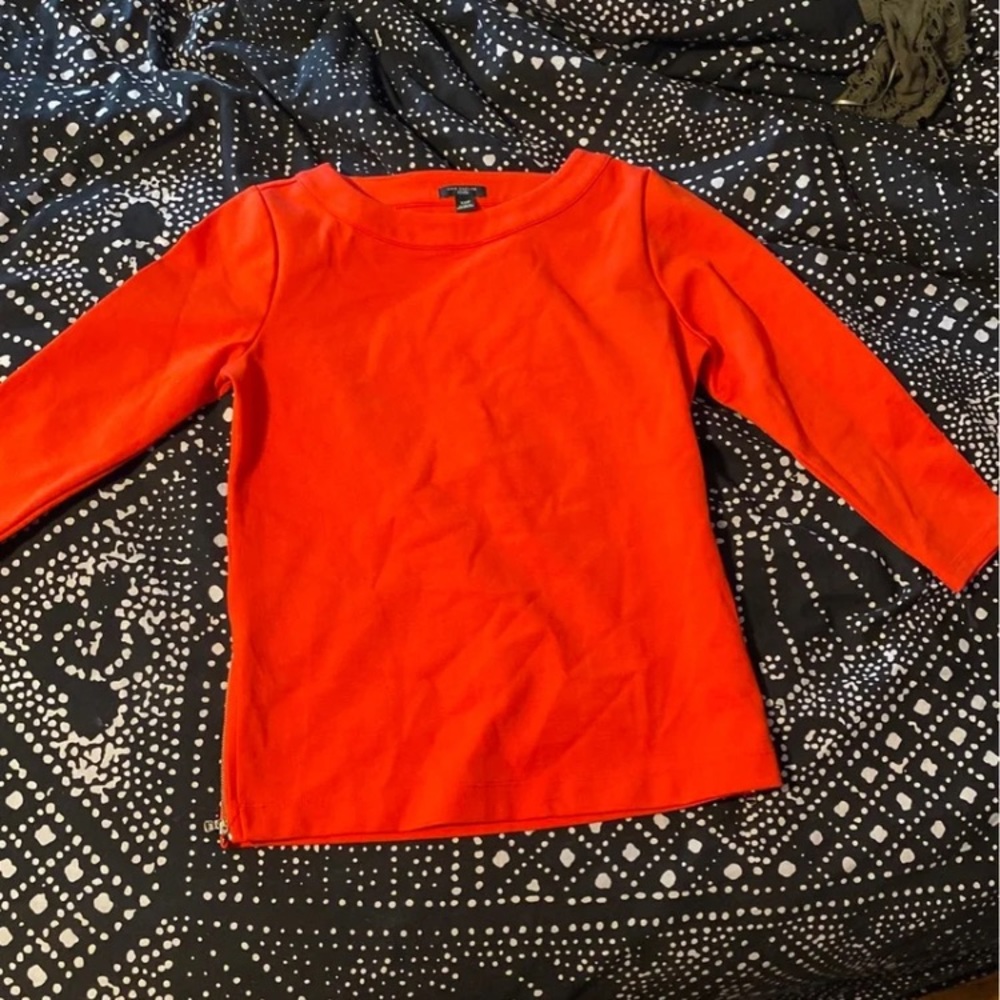 Ann Taylor red top with side zippers.